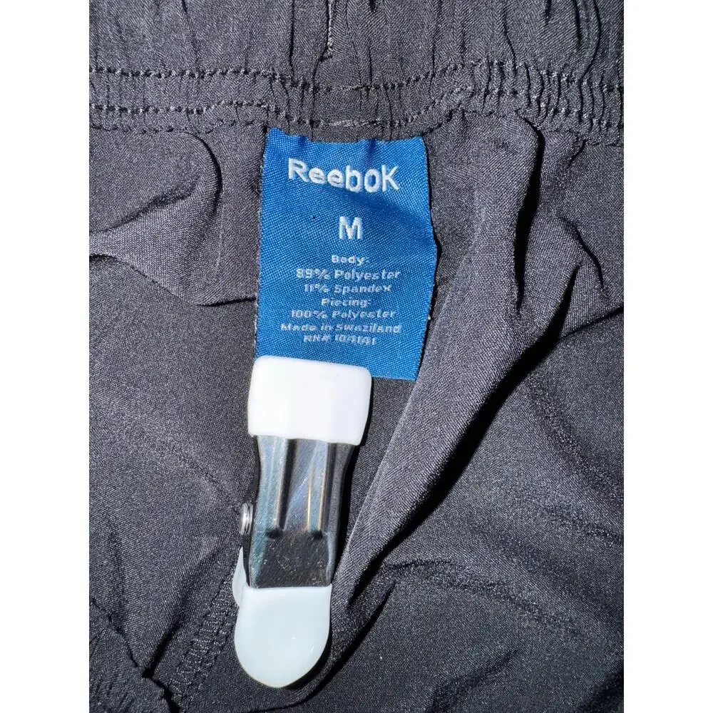 Vintage Reebok Y2K black wind pants men’s medium elastic waist retro athletic